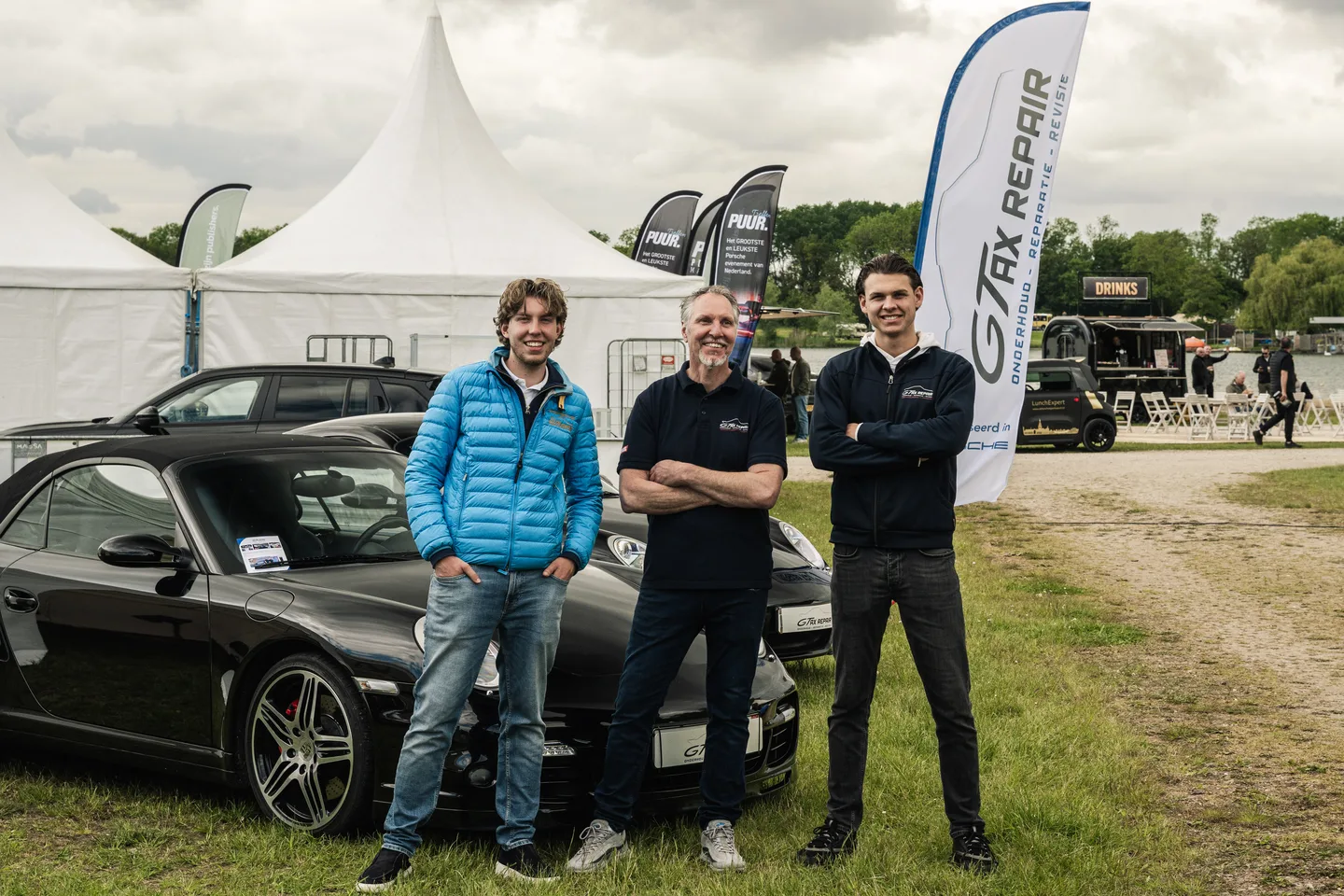Team van GTAX Repair naast de bedrijfsauto